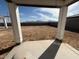 The covered patio offers views of mountain range in the distance from the home at 9613 W Parkway Dr, Tolleson, AZ 85353
