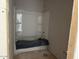 Unfinished bathroom with a newly installed white shower stall at 9613 W Parkway Dr, Tolleson, AZ 85353