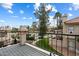 Balcony overlooking community pool and well-maintained landscaping, perfect for relaxing and enjoying the views at 9705 E Mountain View Rd # 1143, Scottsdale, AZ 85258
