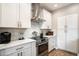 Modern kitchen features stainless steel appliances, sleek white cabinets, and quartz countertops at 9705 E Mountain View Rd # 1143, Scottsdale, AZ 85258