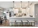 Modern kitchen island with white quartz countertop and stylish pendant lighting at 9705 E Mountain View Rd # 1143, Scottsdale, AZ 85258