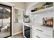 Bright modern kitchen with stylish counter, wine storage, and natural light from the patio at 9705 E Mountain View Rd # 1143, Scottsdale, AZ 85258