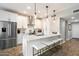 Modern kitchen with white cabinets, quartz countertops, and stainless steel appliances at 9705 E Mountain View Rd # 1143, Scottsdale, AZ 85258
