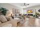 Cozy living room features comfortable seating, a fireplace, and a large screen TV at 9705 E Mountain View Rd # 1143, Scottsdale, AZ 85258