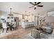 Bright open-concept showcasing kitchen, dining, and living area with modern finishes and appliances at 9705 E Mountain View Rd # 1143, Scottsdale, AZ 85258