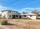 Backyard featuring a chain link fence enclosing a two story home at 1153 E 12Th St, Casa Grande, AZ 85122