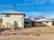 Spacious fenced backyard featuring a covered patio and access to the two-story house at 1153 E 12Th St, Casa Grande, AZ 85122