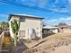 Spacious backyard featuring a patio area, tall cactus, and a chain-link fence at 1153 E 12Th St, Casa Grande, AZ 85122