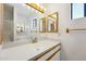 Bathroom featuring dual mirrors, a sink with vanity, and a shower stall at 1153 E 12Th St, Casa Grande, AZ 85122