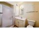 This bathroom features a shower, toilet, vanity sink, mirror, and medicine cabinet at 1153 E 12Th St, Casa Grande, AZ 85122