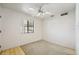 This bedroom features a ceiling fan and a window looking out to the neighborhood at 1153 E 12Th St, Casa Grande, AZ 85122