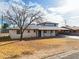 Cozy home with a mature tree in the front yard, with a carport offering covered parking at 1153 E 12Th St, Casa Grande, AZ 85122