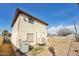 The side and back of a home with a two story structure and HVAC unit at 1153 E 12Th St, Casa Grande, AZ 85122