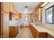 Functional kitchen with oak wood cabinets, vinyl flooring, and ample counter space at 1153 E 12Th St, Casa Grande, AZ 85122