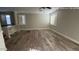 Spacious living room with wood-look floors, offering ample natural light at 1167 W Dana Dr, San Tan Valley, AZ 85143