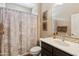 Bathroom featuring a vanity with granite countertops, a shower-tub combination, and ample lighting at 12734 W Crestvale Dr, Peoria, AZ 85383