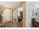 Inviting foyer features stylish wood-look flooring and a bright entryway with views into the home's living spaces at 12734 W Crestvale Dr, Peoria, AZ 85383