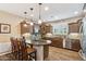 Stylish kitchen with granite countertops, wood cabinets, and stainless steel appliances at 12734 W Crestvale Dr, Peoria, AZ 85383