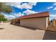 Rear exterior view of home featuring covered patio and desert landscaping at 12826 S 40Th Pl, Phoenix, AZ 85044