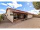 Rear exterior view of home featuring covered patio and desert landscaping at 12826 S 40Th Pl, Phoenix, AZ 85044