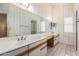 Bathroom featuring dual sinks, a large mirror, and ample counter space, perfect for a relaxing spa-like experience at 12826 S 40Th Pl, Phoenix, AZ 85044