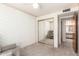 Bedroom featuring neutral tones, carpeted floor, and mirrored closet door at 12826 S 40Th Pl, Phoenix, AZ 85044