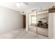 Bedroom features carpeted floors and mirrored closet door at 12826 S 40Th Pl, Phoenix, AZ 85044