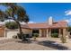 Single-story home featuring mature trees and a low maintenance xeriscaped front yard at 12826 S 40Th Pl, Phoenix, AZ 85044