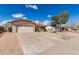 A single-story home featuring an extra-wide driveway and low maintenance landscaping at 12826 S 40Th Pl, Phoenix, AZ 85044