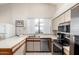 A kitchen with stainless steel appliances and plenty of counter space is the perfect spot for home-cooked meals at 12826 S 40Th Pl, Phoenix, AZ 85044