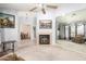 Spacious living room featuring a fireplace, high ceilings, carpeted floors, and mirrored wall at 12826 S 40Th Pl, Phoenix, AZ 85044