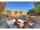 Charming backyard offers a cozy fireplace and comfortable seating at 13007 W Tuckey Ct, Glendale, AZ 85307