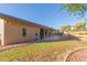 Exterior view of the house with a spacious backyard, patio, and landscaped with green grass at 13007 W Tuckey Ct, Glendale, AZ 85307