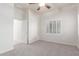 Bright bedroom boasts a shuttered window, neutral paint, and carpet for a relaxing and inviting atmosphere at 13007 W Tuckey Ct, Glendale, AZ 85307