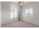 Bright bedroom with plantation shutters and a neutral carpeted floor at 13007 W Tuckey Ct, Glendale, AZ 85307