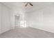 Spacious carpeted bedroom with ceiling fan and bright natural light at 13007 W Tuckey Ct, Glendale, AZ 85307
