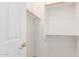 A well-organized closet space with wooden rods and shelves, promoting efficient storage and accessibility at 13007 W Tuckey Ct, Glendale, AZ 85307