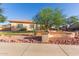 Charming single-story home featuring desert landscaping and stone accents at 13007 W Tuckey Ct, Glendale, AZ 85307