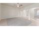 Open-concept living room with tile flooring and neutral walls at 13007 W Tuckey Ct, Glendale, AZ 85307