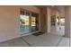 A covered patio with a sliding glass door and windows is perfect for enjoying the outdoors at 13007 W Tuckey Ct, Glendale, AZ 85307