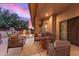 Cozy outdoor patio offers comfortable seating and ambient lighting at 13007 W Tuckey Ct, Glendale, AZ 85307