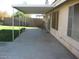 Large covered patio with lush green grass in the backyard at 1306 W Charleston Ave, Phoenix, AZ 85023