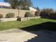 Green backyard with a block wall at 1306 W Charleston Ave, Phoenix, AZ 85023