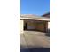 Spacious garage with built-in storage cabinets for organized parking and storage at 1306 W Charleston Ave, Phoenix, AZ 85023