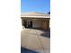 Attached two car garage featuring built-in storage cabinets along the back wall at 1306 W Charleston Ave, Phoenix, AZ 85023