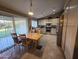 Open-concept kitchen with updated appliances, island, and sliding glass door at 1306 W Charleston Ave, Phoenix, AZ 85023