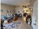 Open living room leading to the dining area, filled with natural light at 1306 W Charleston Ave, Phoenix, AZ 85023