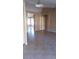 Spacious living room featuring neutral colors and tile flooring at 1306 W Charleston Ave, Phoenix, AZ 85023