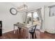 Cozy dining area with backyard views, and modern light fixture at 13308 W Acapulco Ln, Surprise, AZ 85379