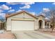 Charming single-story home featuring a two-car garage and desert landscaping for low maintenance at 13308 W Acapulco Ln, Surprise, AZ 85379